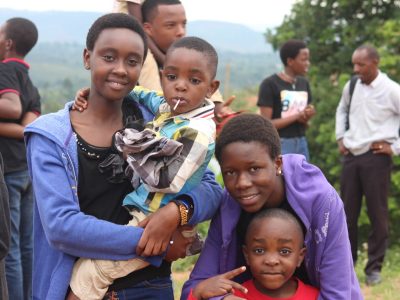 A cheerful group of friends enjoying a day outdoors in Gitega, Burundi.